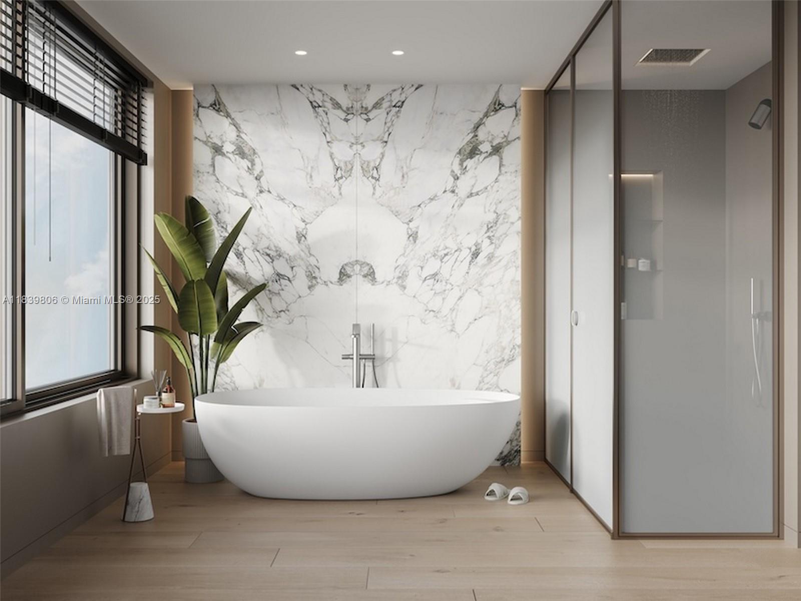 1709 Jefferson Avenue, Unit TH03 Miami Beach, FL 33139 - Photo 9 of 16 a white bath tub sitting in a bathroom