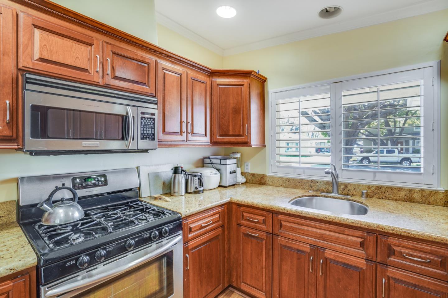 1630 Cross Way San Jose, CA 95125 - Photo 11 of 52 a kitchen with stainless steel appliances granite countertop a sink stove and cabinets