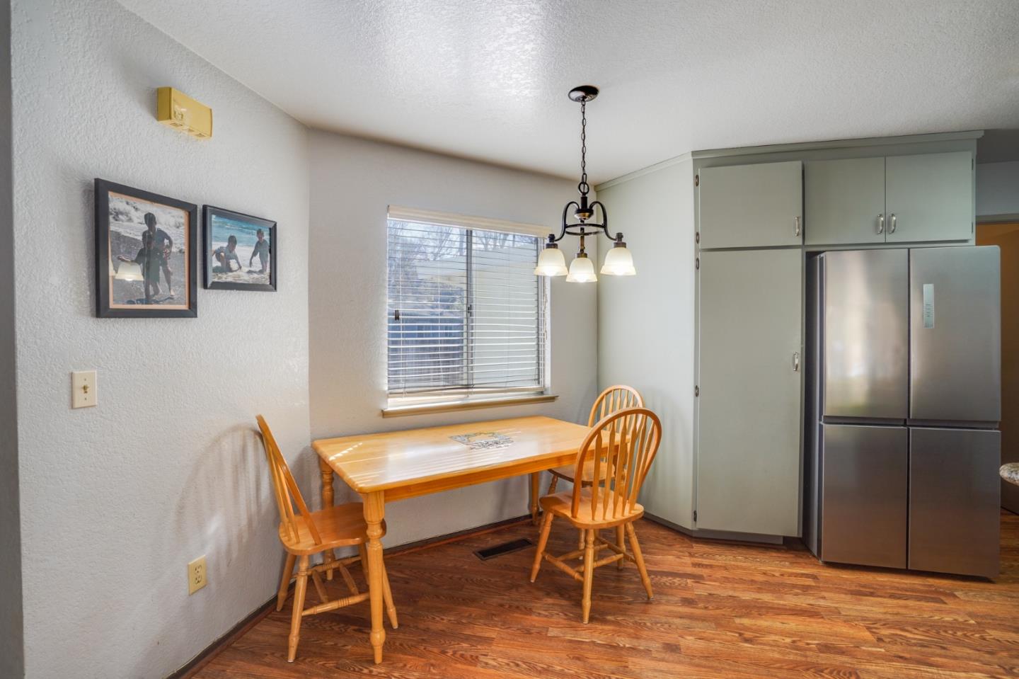 1630 Cross Way San Jose, CA 95125 - Photo 33 of 52 a view of a dining room with furniture a chandelier and wooden floor