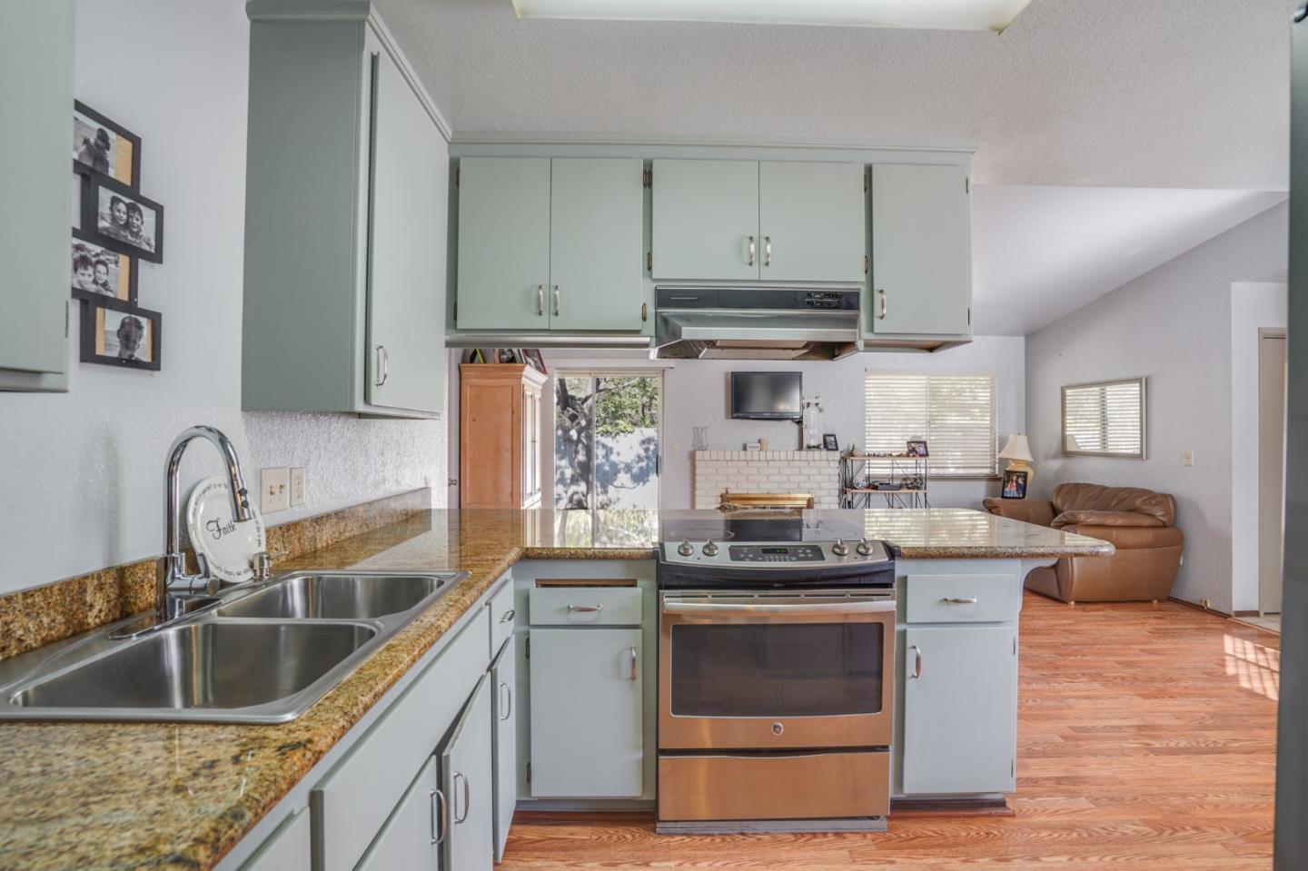 1630 Cross Way San Jose, CA 95125 - Photo 35 of 52 a kitchen with stainless steel appliances granite countertop a sink stove and refrigerator