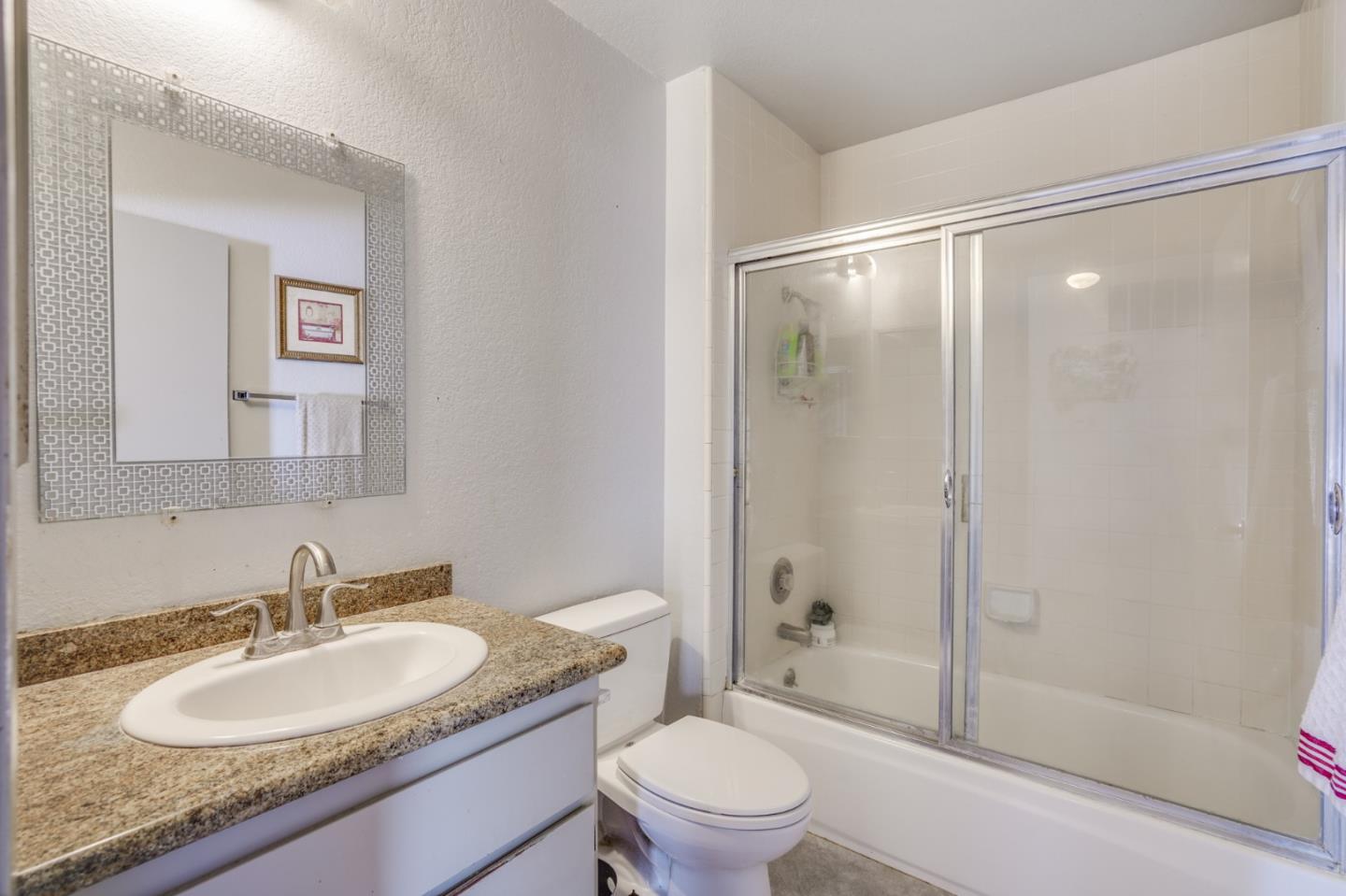 1630 Cross Way San Jose, CA 95125 - Photo 42 of 52 a bathroom with a granite countertop sink toilet mirror and shower