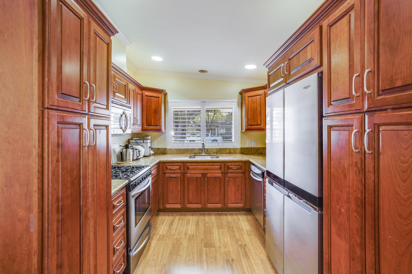 1630 Cross Way San Jose, CA 95125 - Photo 10 of 52 a kitchen with stainless steel appliances granite countertop a refrigerator a stove and a wooden cabinets