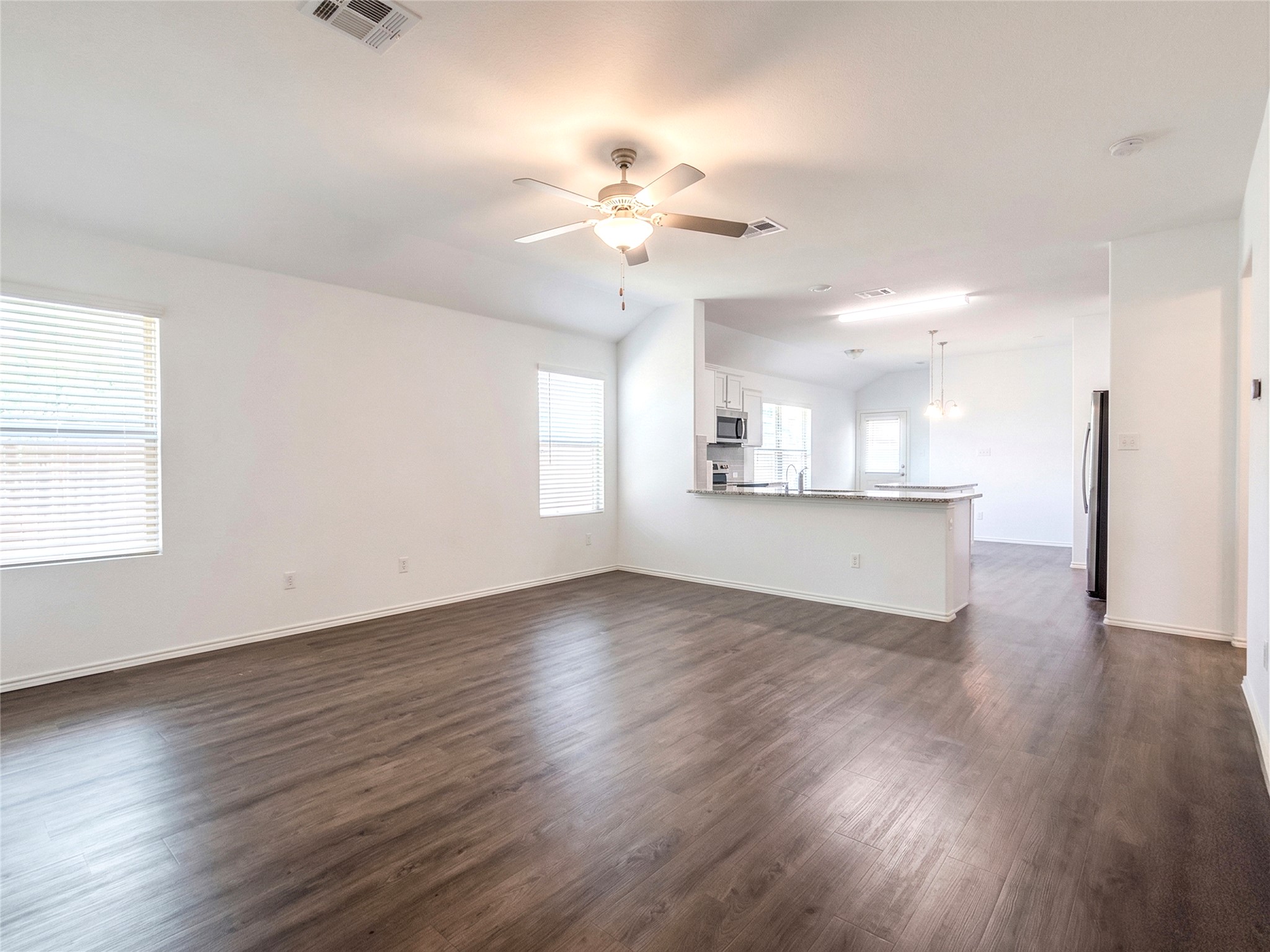 113 Star Pass Jarrell, TX 76537 - Photo 8 of 25 Looking from Living Room into Kitchen