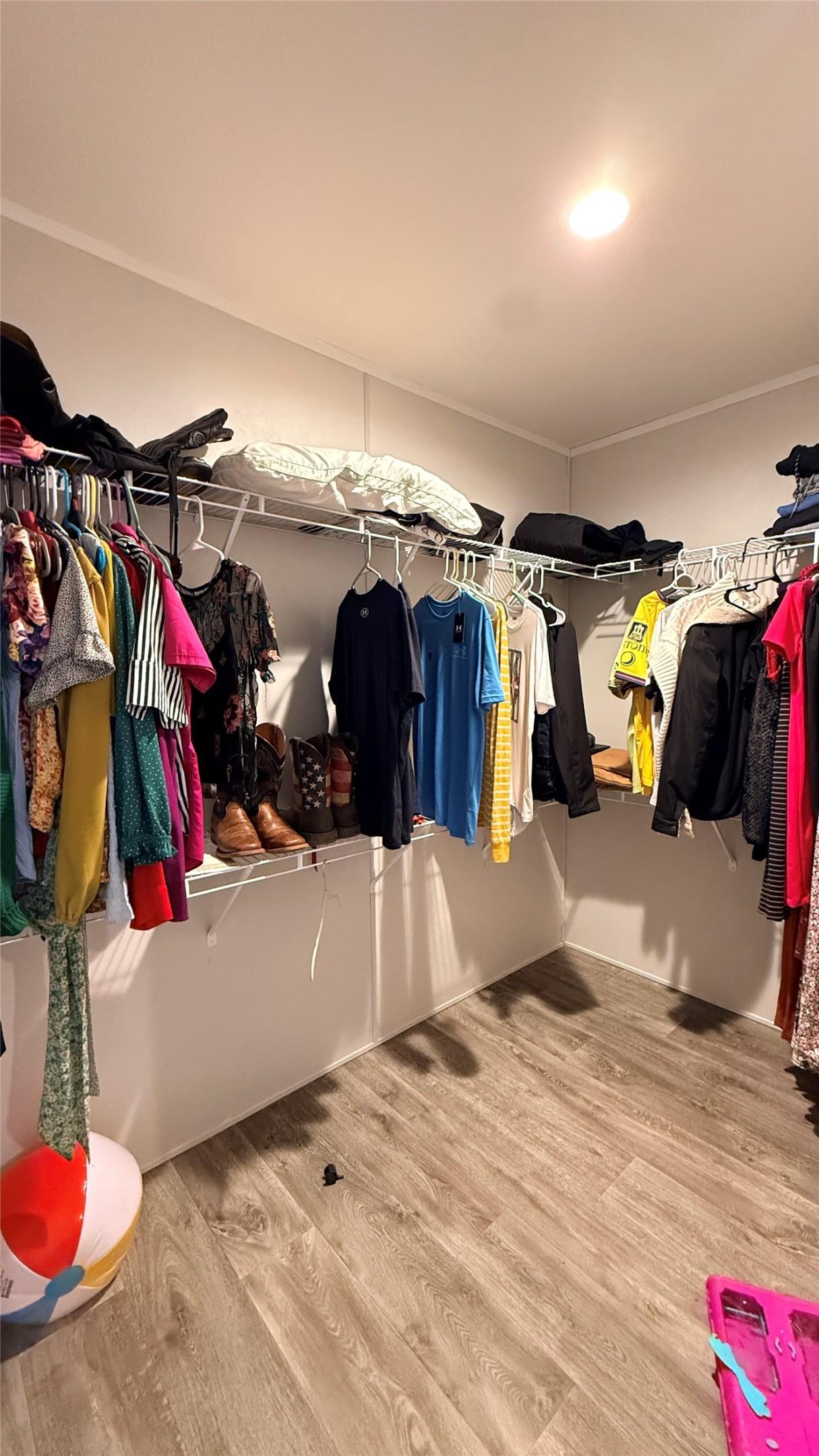 1338 Wheatgrass Road Salado, TX 76571 - Photo 8 of 19 Ample storage solutions define this practical walk-in closet with durable flooring.