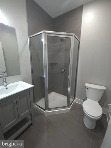 a bathroom with a toilet sink and shower