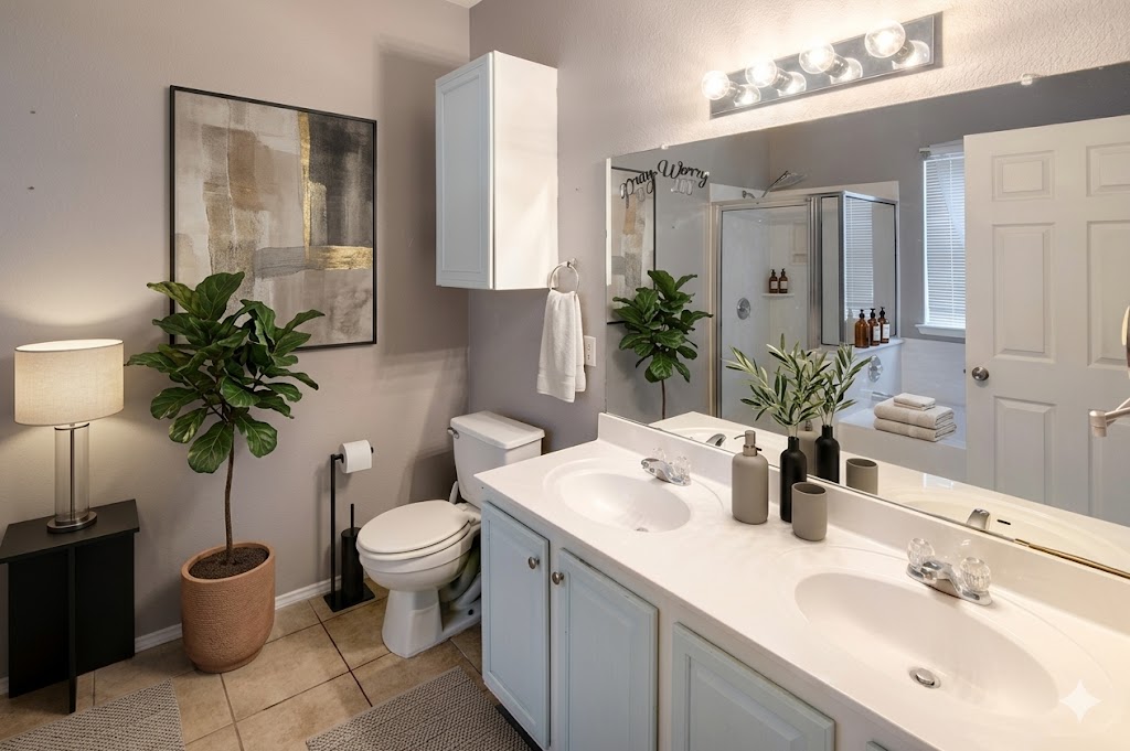 508 Emma Rose Trail Leander, TX 78641 - Photo 6 of 40 Dual vanities and a glass-enclosed shower create a serene bathing experience.
