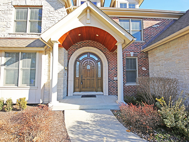 527 Ranch Road Wheaton, IL 60187 - Photo 2 of 25 a front view of a house with a yard