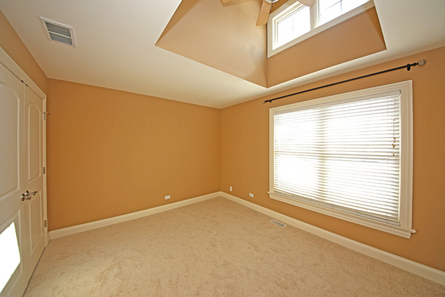 527 Ranch Road Wheaton, IL 60187 - Photo 14 of 25 a view of an empty room with a window