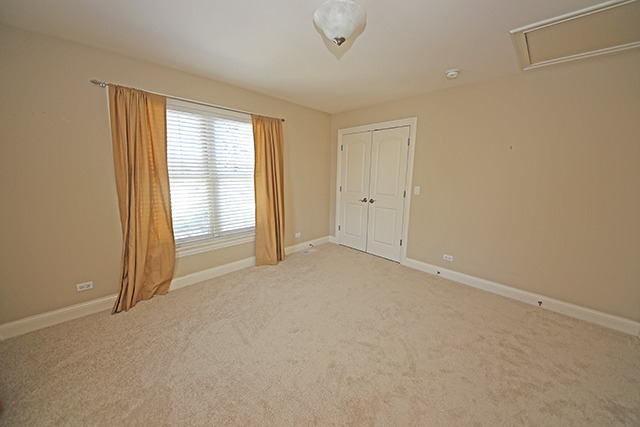 527 Ranch Road Wheaton, IL 60187 - Photo 15 of 25 a view of an empty room with a window