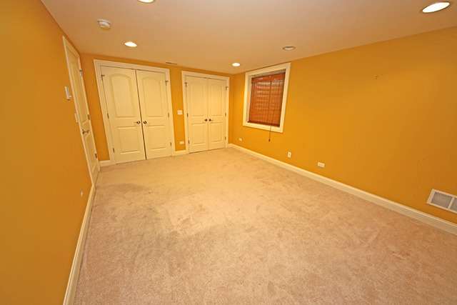 527 Ranch Road Wheaton, IL 60187 - Photo 19 of 25 a view of an empty room with a window