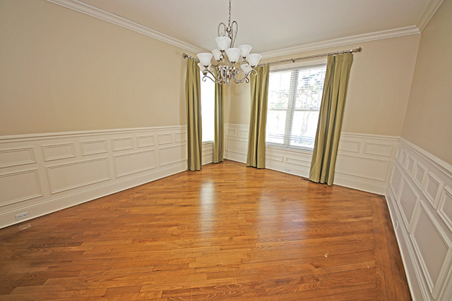 527 Ranch Road Wheaton, IL 60187 - Photo 5 of 25 a view of empty room with window and chandelier