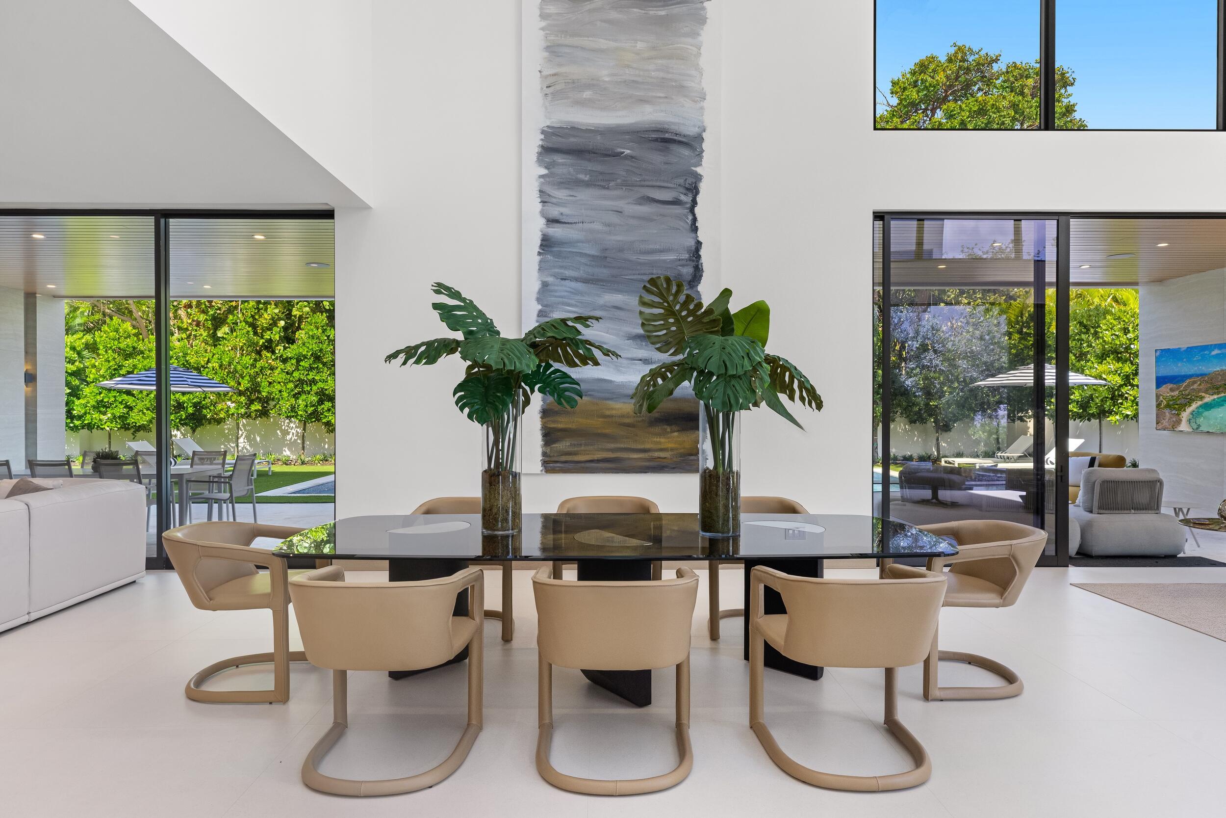 1351 Cocoanut Road Boca Raton, FL 33432 - Photo 33 of 101 a dining room with furniture a potted plant and a large window