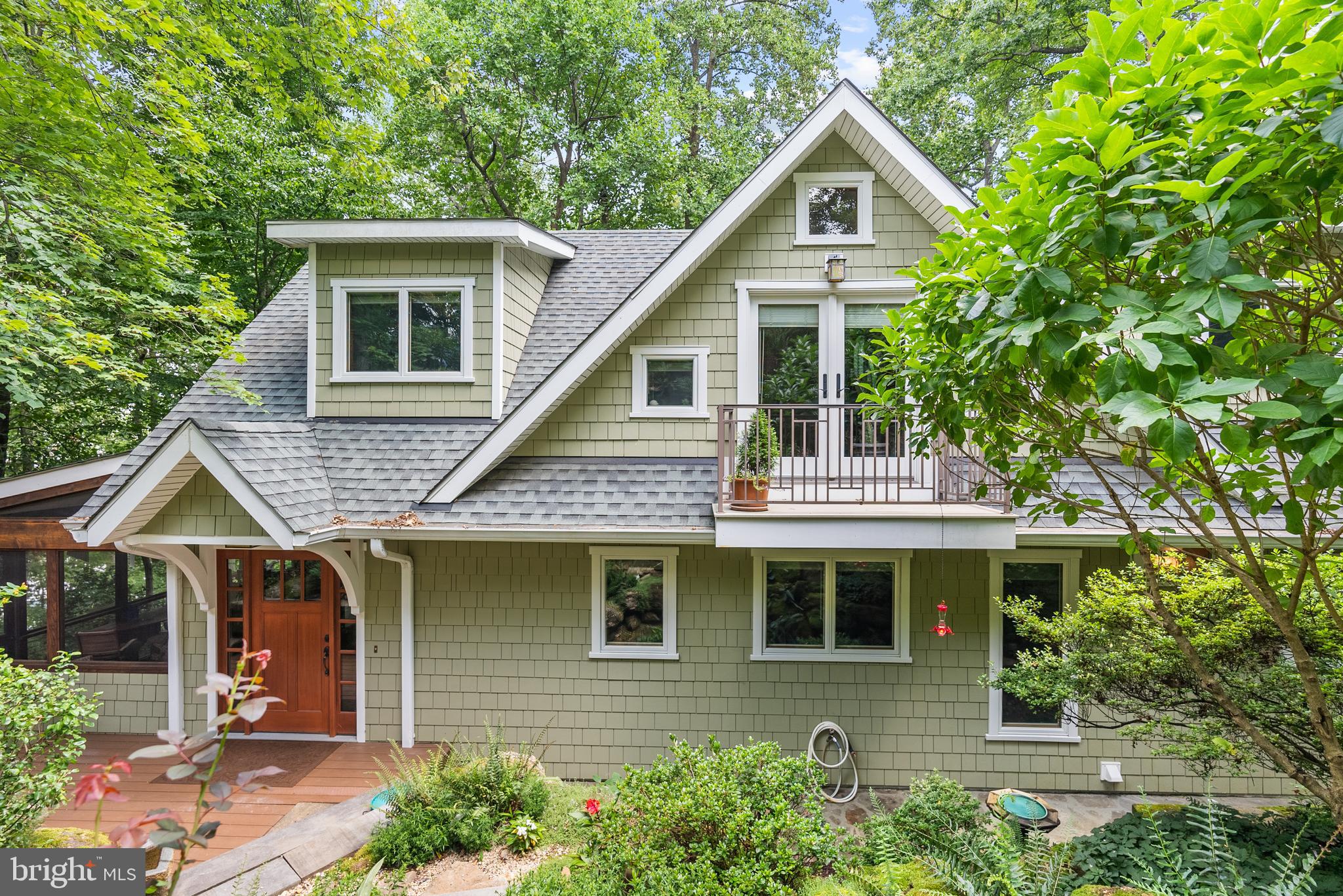 357 Overlook Trail Annapolis, MD 21401 - Photo 5 of 45 a front view of a house with a yard and potted plants