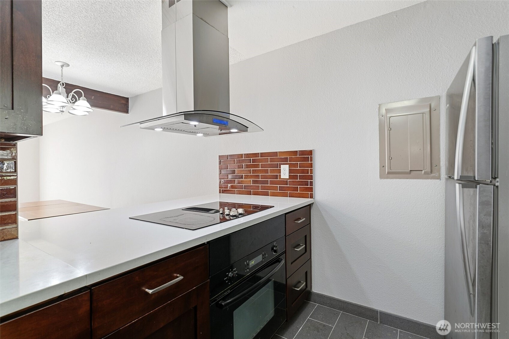 1802 Maple Lane, Unit A5 Kent, WA 98030 - Photo 4 of 27 a kitchen with stainless steel appliances granite countertop a sink stove and refrigerator