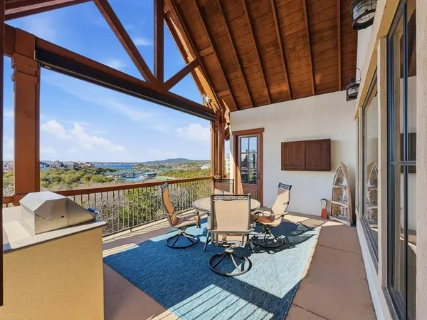 a view of a balcony and chairs