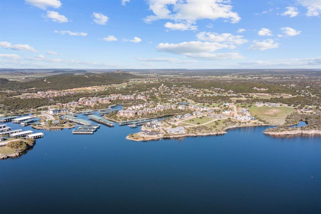 2033 Harbor Way, Unit 302 Graford, TX 76449 - Photo 23 of 28 an aerial view of ocean and residential houses with outdoor space