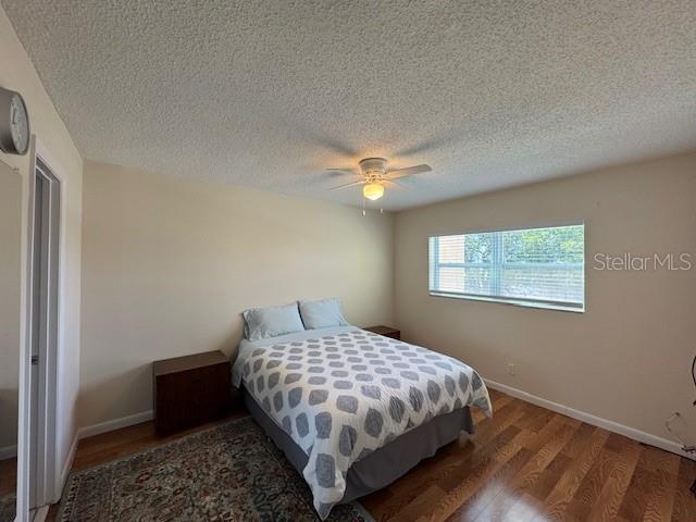 11485 Oakhurst Road, Unit 319 Largo, FL 33774 - Photo 7 of 63 a bedroom with a bed and a window