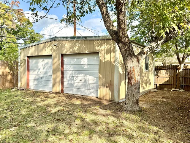 a view of a house with a tree