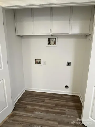 an empty room with wooden floor