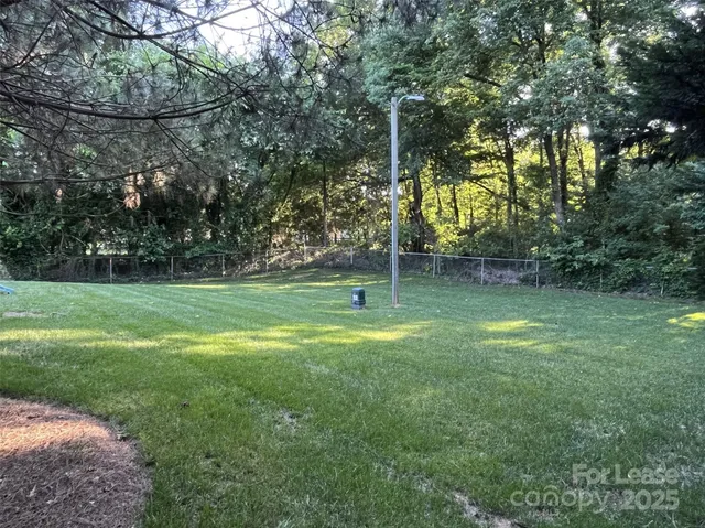 a backyard of a house with lots of green space