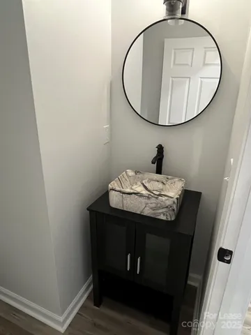a bathroom with a sink and mirror