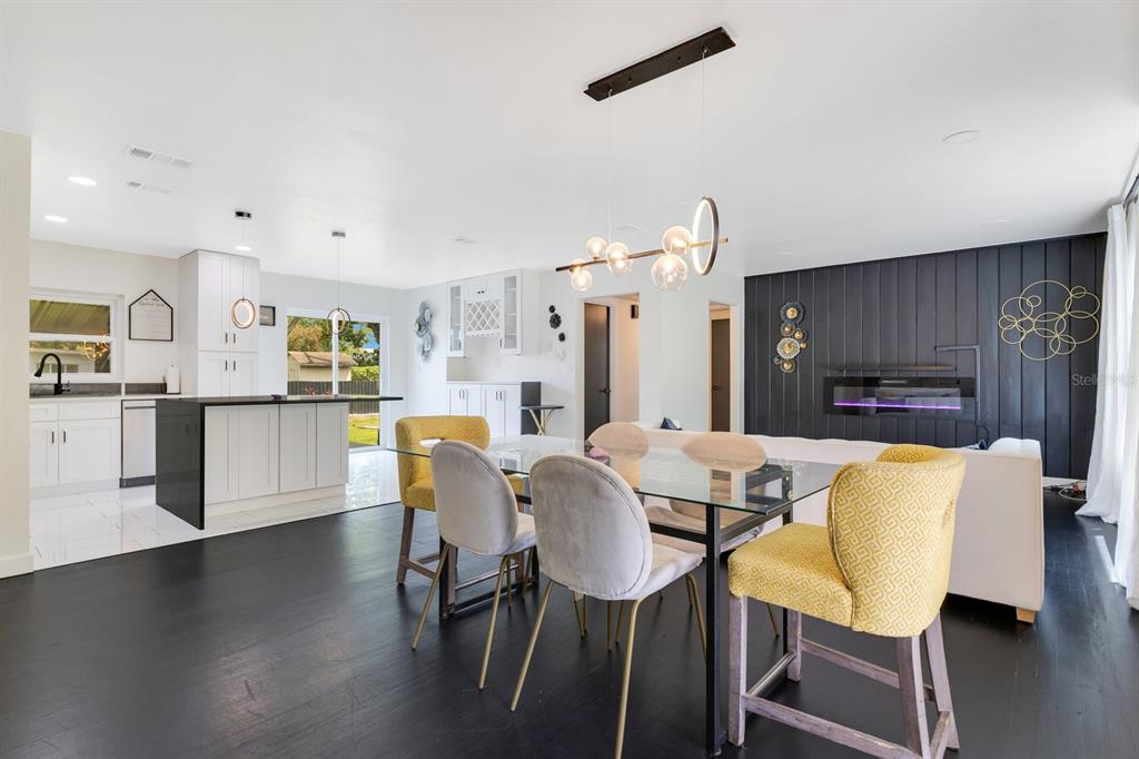 344 Starling Road Winter Park, FL 32789 - Photo 13 of 43 a view of a dining room with furniture and wooden floor