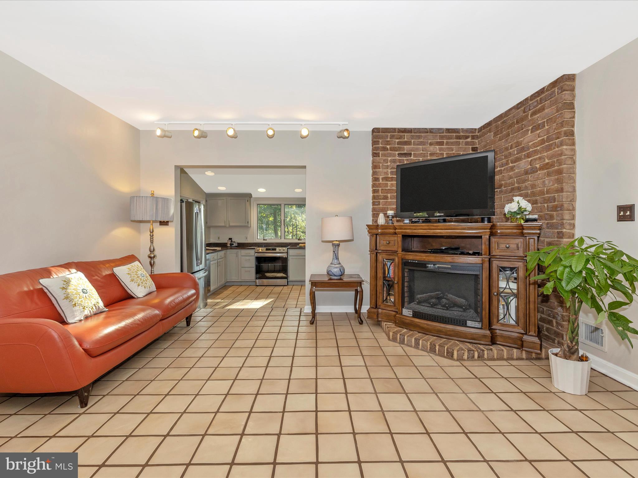 203 Sunset Avenue Mount Airy, MD 21771 - Photo 8 of 57 Great Room has Masonry Hearth & Electric Fireplace