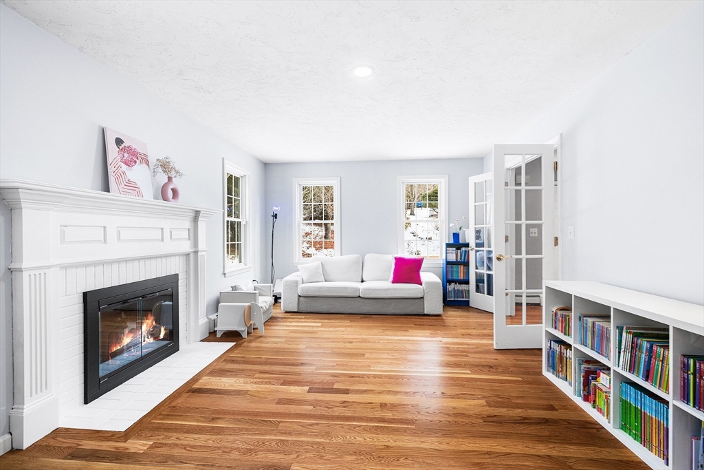 13 Jonathans Way Upton, MA 01568 - Photo 11 of 36 a living room with furniture and a fireplace