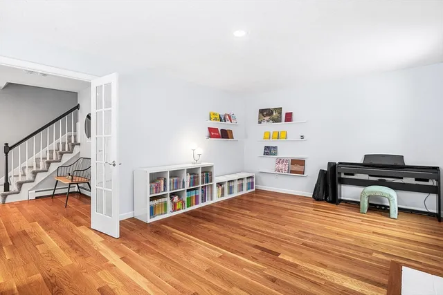 a bedroom with a bed and a book shelf