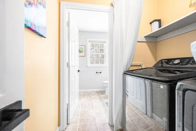 a view of a bathroom from a corridor