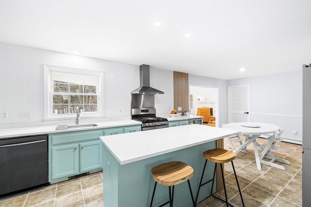 13 Jonathans Way Upton, MA 01568 - Photo 2 of 36 a kitchen with a stove a sink and a refrigerator