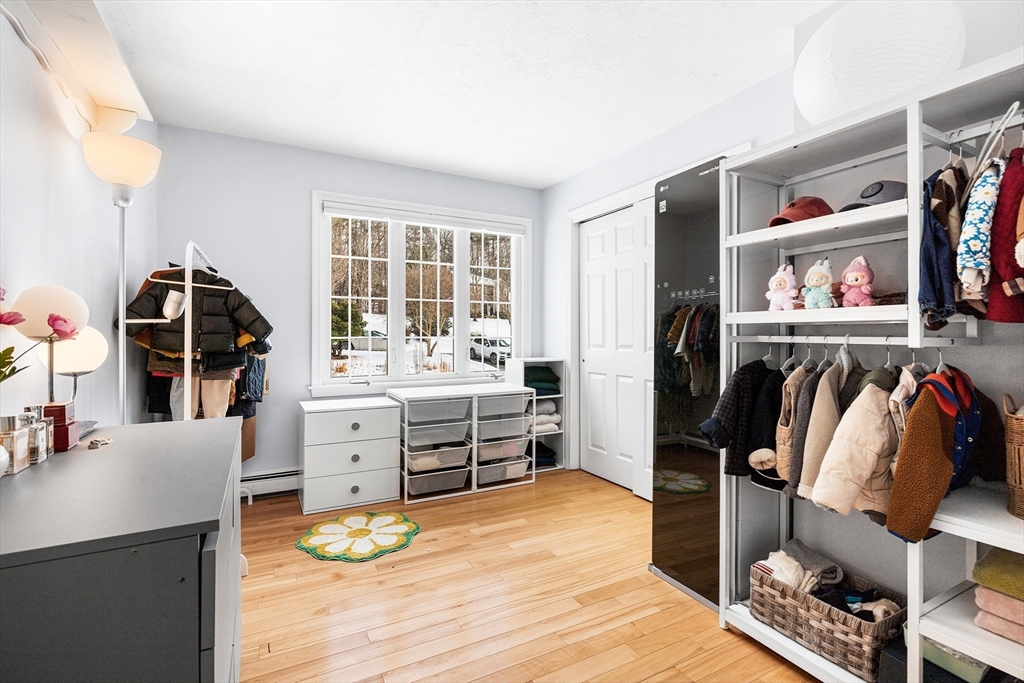13 Jonathans Way Upton, MA 01568 - Photo 21 of 36 a living room with furniture and a flat screen tv