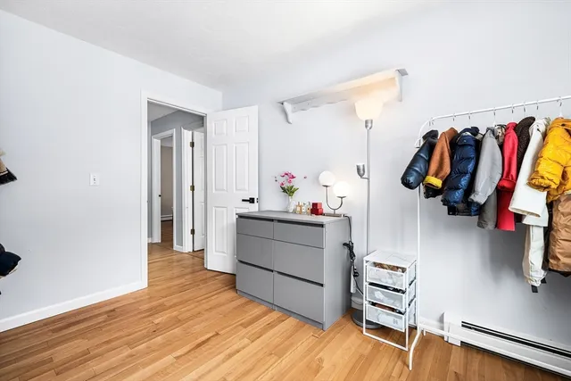 a living room with furniture and a closet
