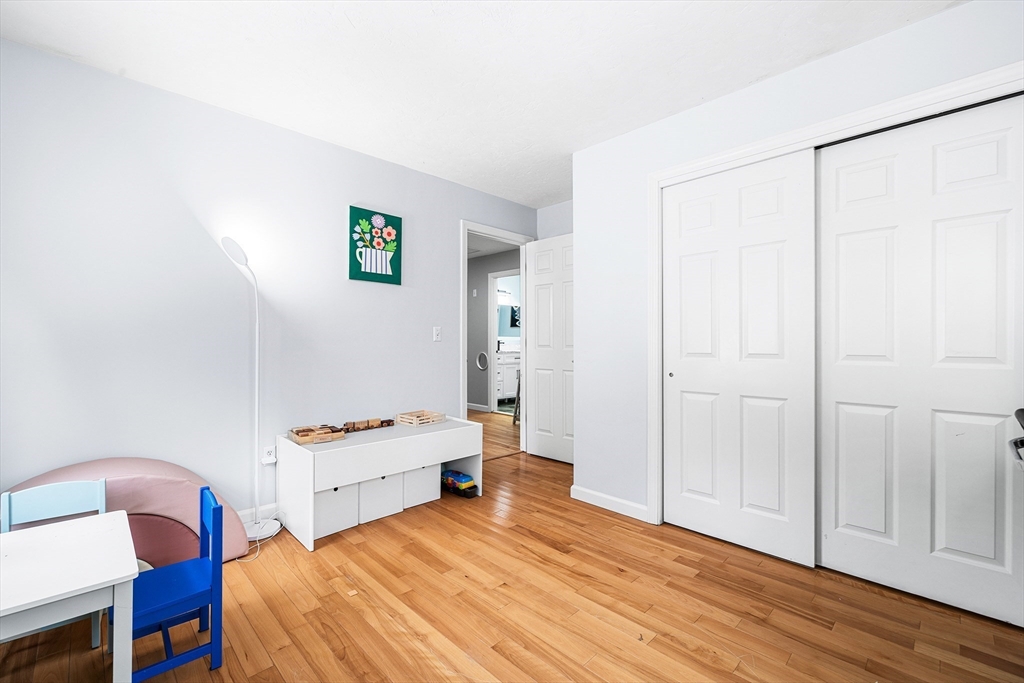 13 Jonathans Way Upton, MA 01568 - Photo 26 of 36 a bedroom with a bed and a table