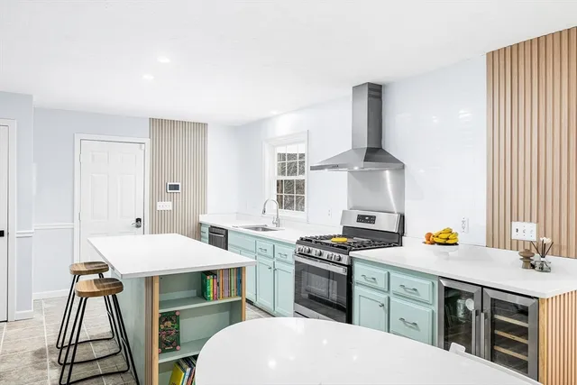 a kitchen with a sink stove and cabinets