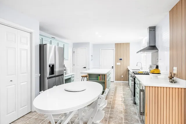 a very nice looking dining room with a table and chairs
