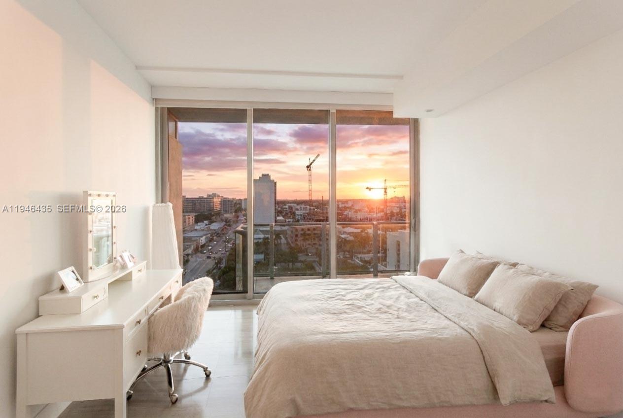 6901 Collins Avenue, Unit 901 Miami Beach, FL 33141 - Photo 13 of 21 a bedroom with a bed and a large window