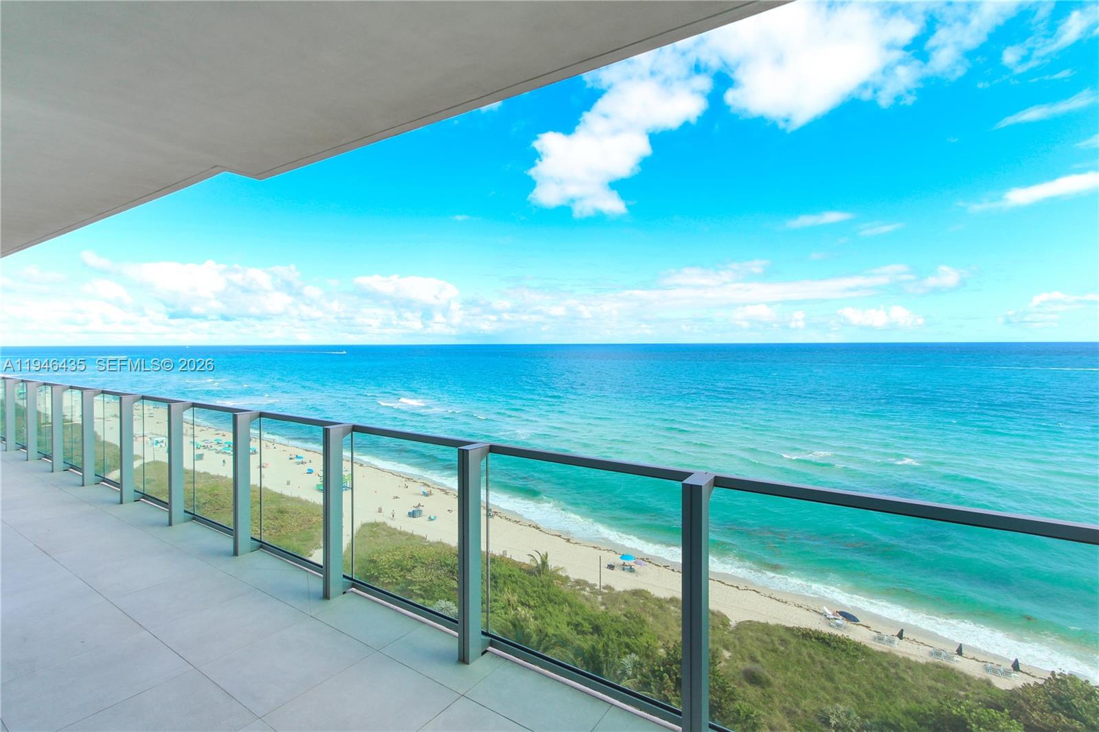 6901 Collins Avenue, Unit 901 Miami Beach, FL 33141 - Photo 2 of 21 a view of an ocean from a balcony