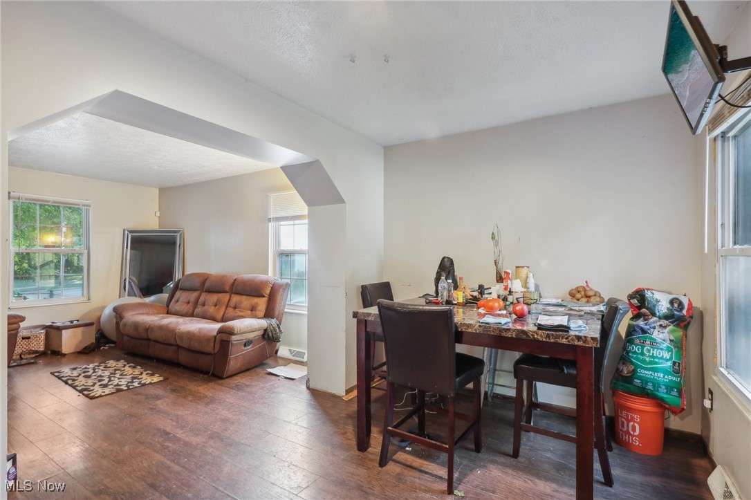 1042 Ansel Road Cleveland, OH 44103 - Photo 14 of 36 Dining area with dark hardwood / wood-style floors and a textured ceiling