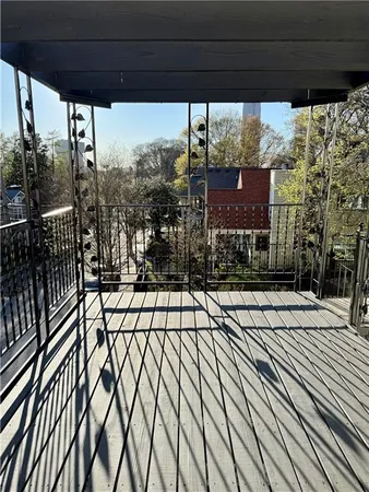 a view of balcony with wooden floor