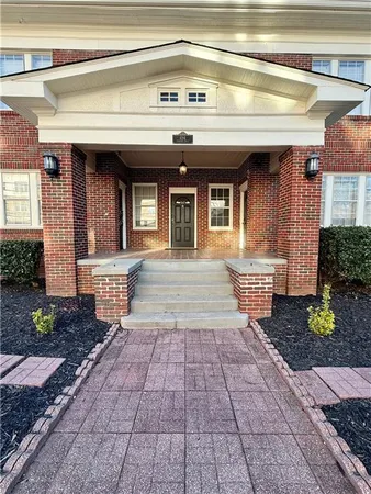 a front view of a house with a porch