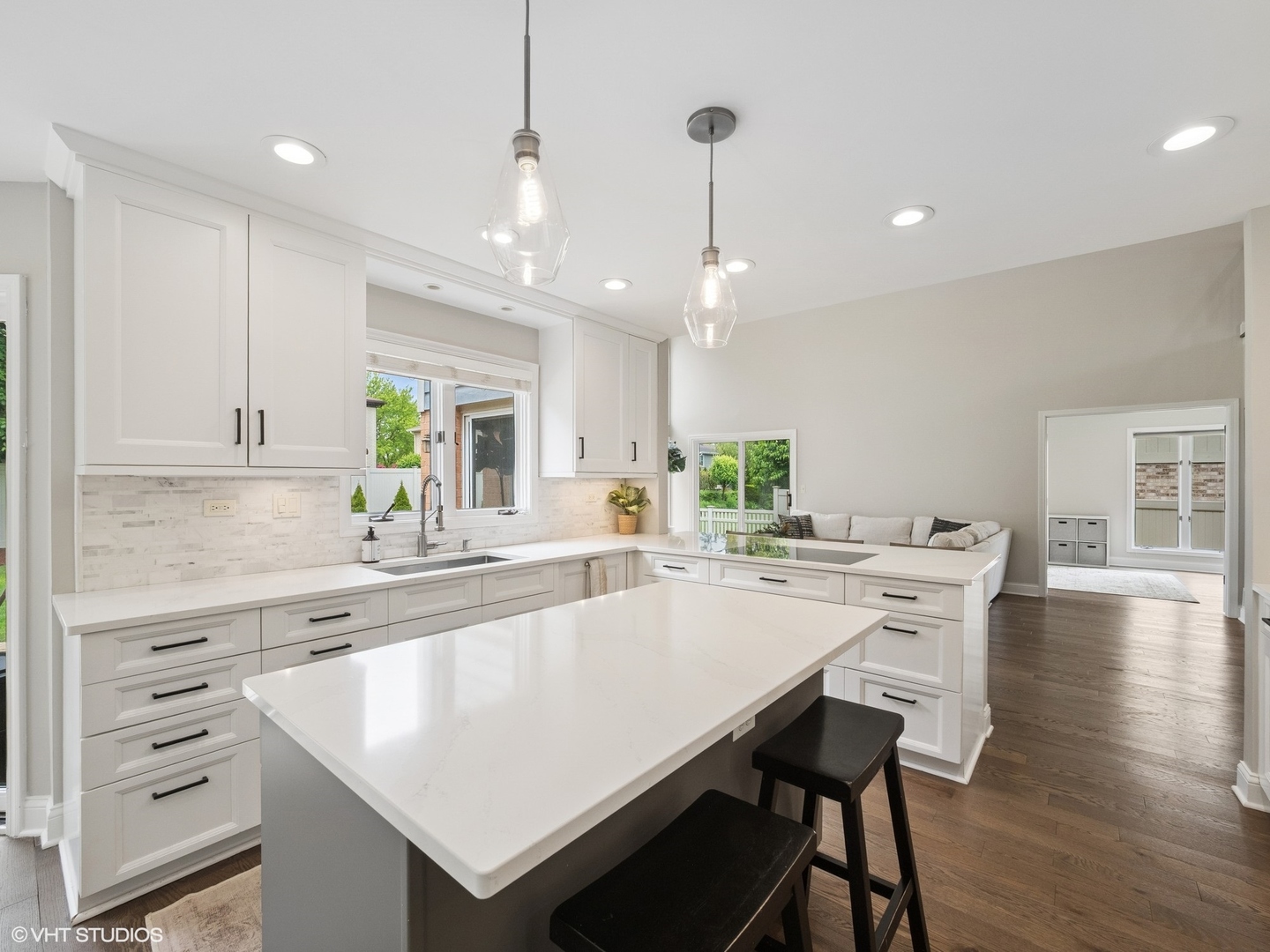 1002 Elmdale Road Glenview, IL 60025 - Photo 16 of 51 a large white kitchen with a table and chairs