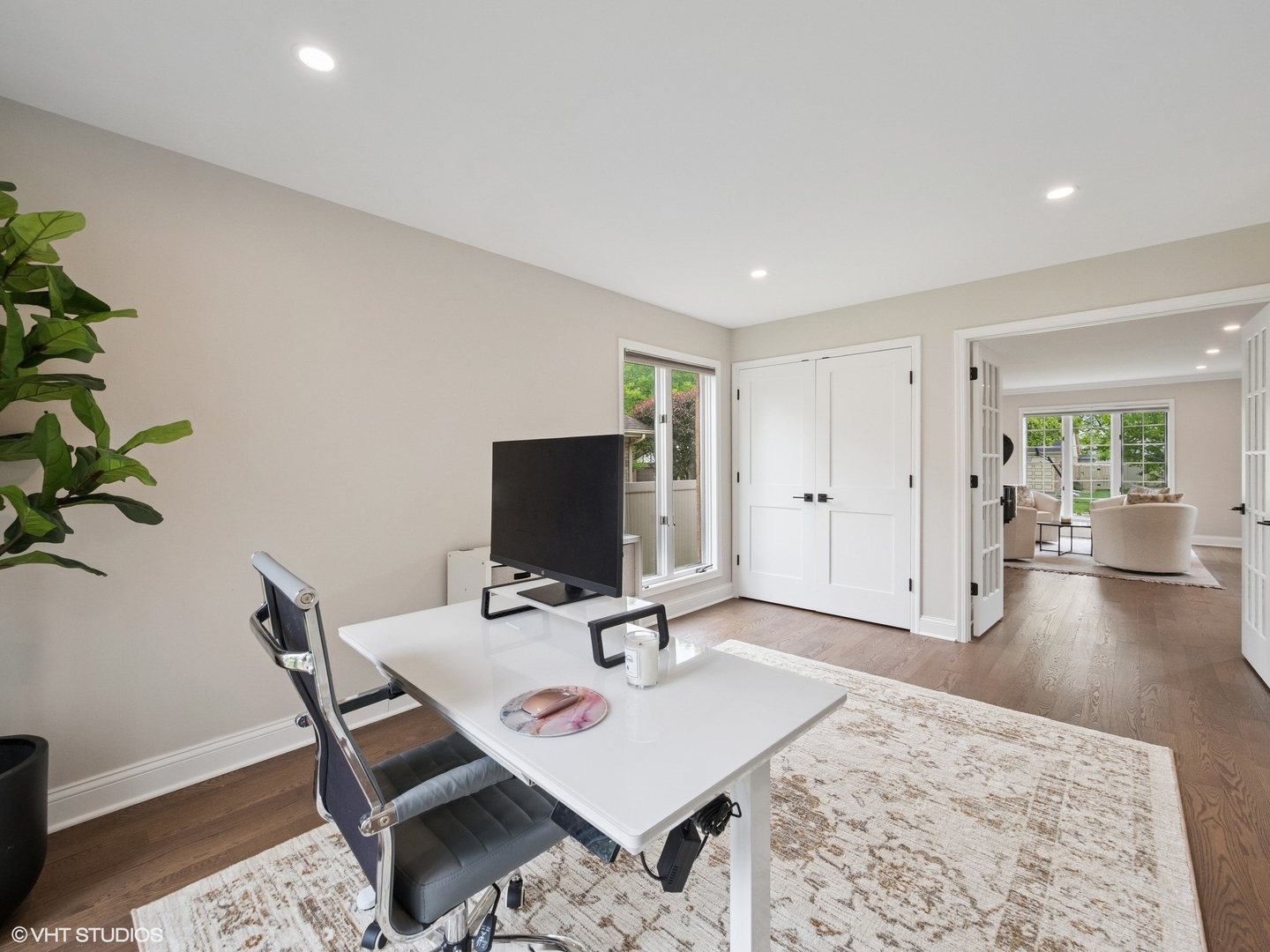 1002 Elmdale Road Glenview, IL 60025 - Photo 22 of 51 a view of a workspace with furniture and wooden floor