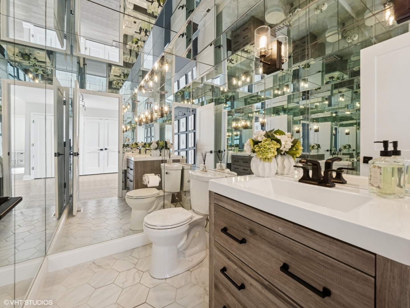 1002 Elmdale Road Glenview, IL 60025 - Photo 24 of 51 a bathroom with a sink mirror and toilet