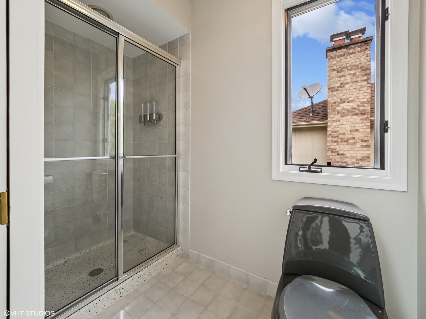 1002 Elmdale Road Glenview, IL 60025 - Photo 30 of 51 a bathroom with a toilet and a shower