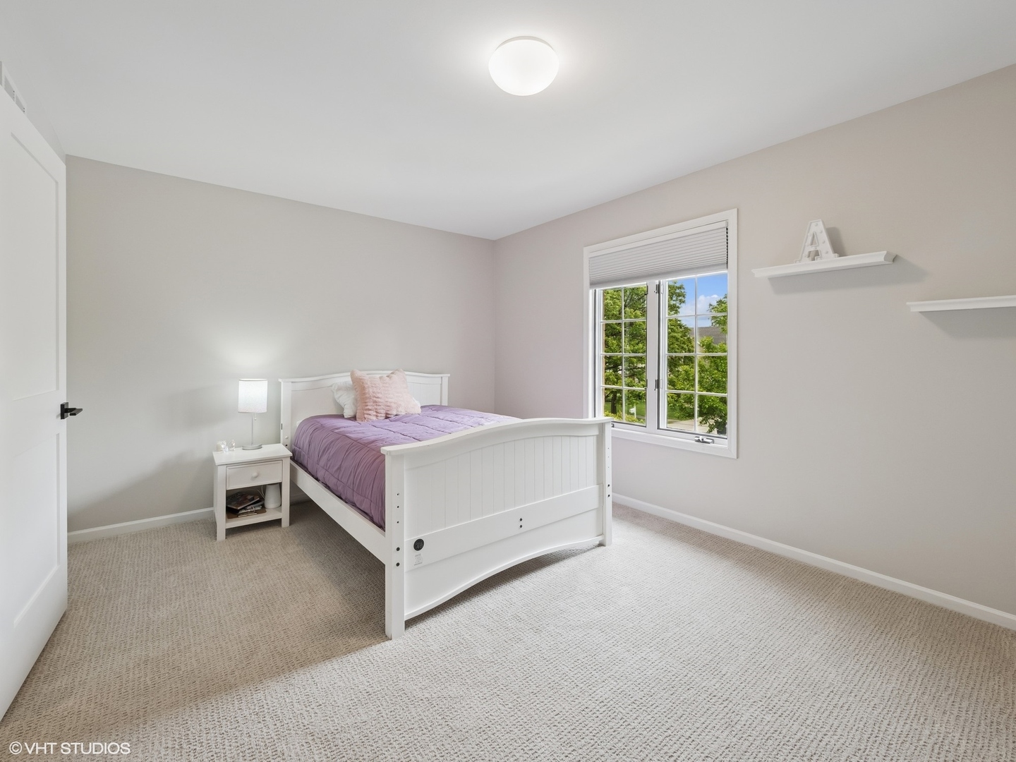 1002 Elmdale Road Glenview, IL 60025 - Photo 31 of 51 a spacious bedroom with a bed and a window