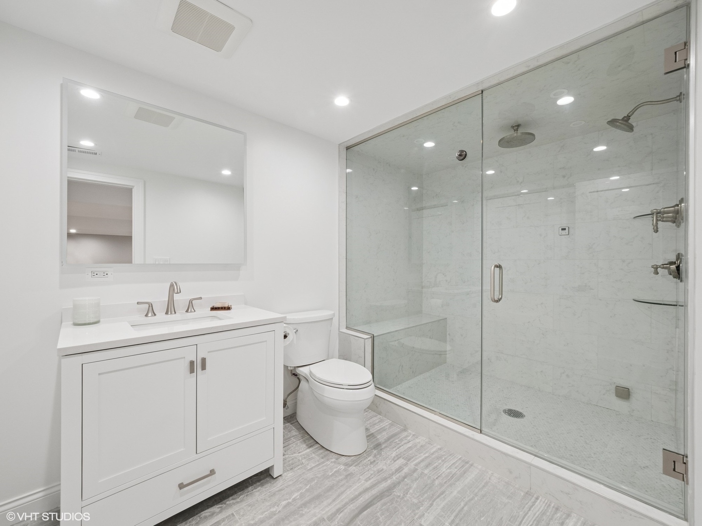 1002 Elmdale Road Glenview, IL 60025 - Photo 42 of 51 a bathroom with a toilet sink and a shower