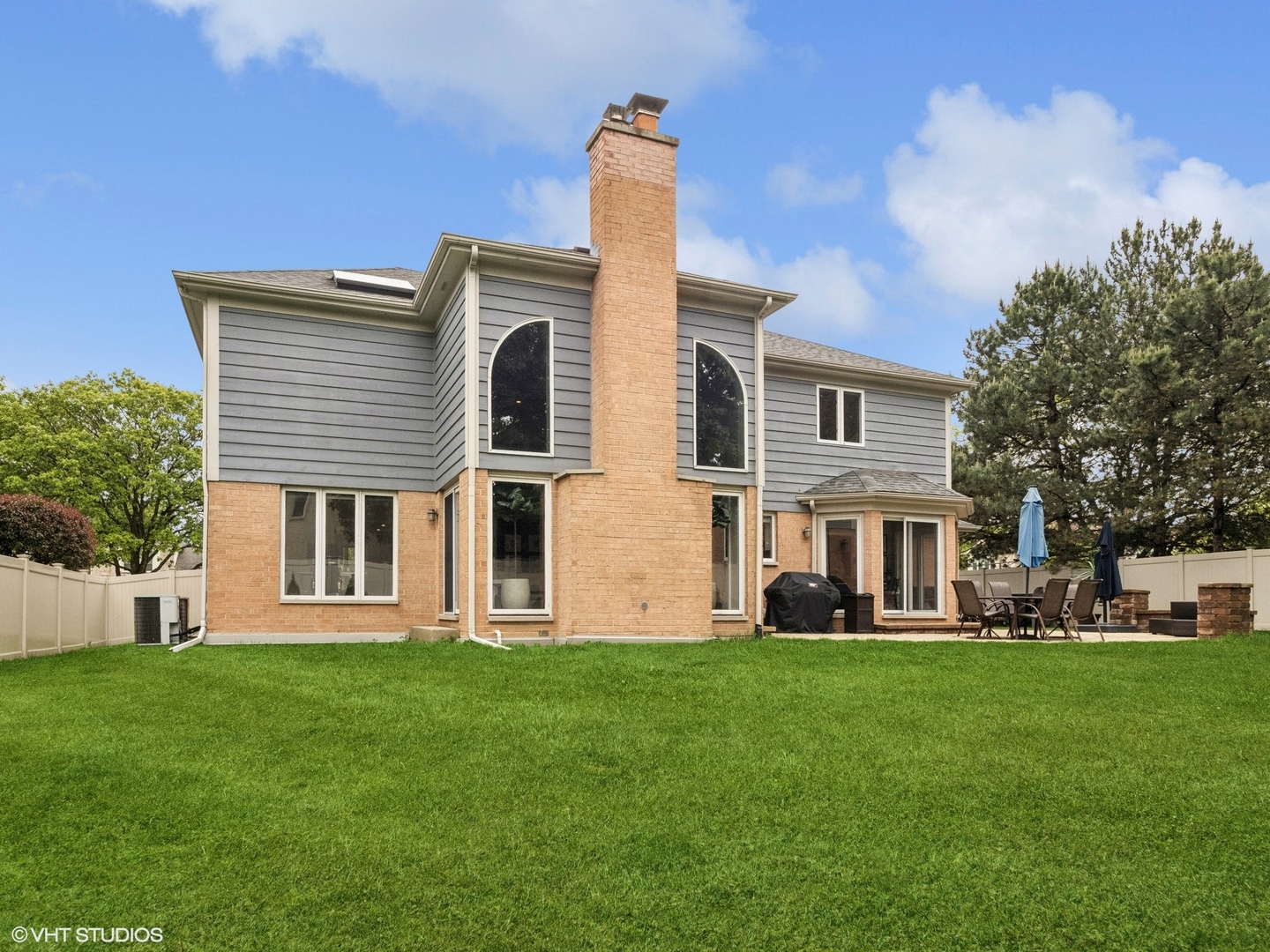 1002 Elmdale Road Glenview, IL 60025 - Photo 44 of 51 a front view of a house with a yard and trees