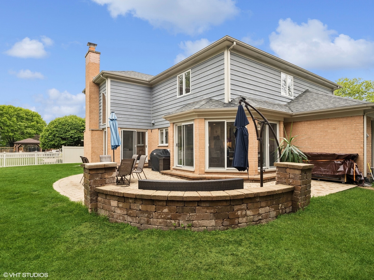 1002 Elmdale Road Glenview, IL 60025 - Photo 45 of 51 a front view of house with a garden and patio