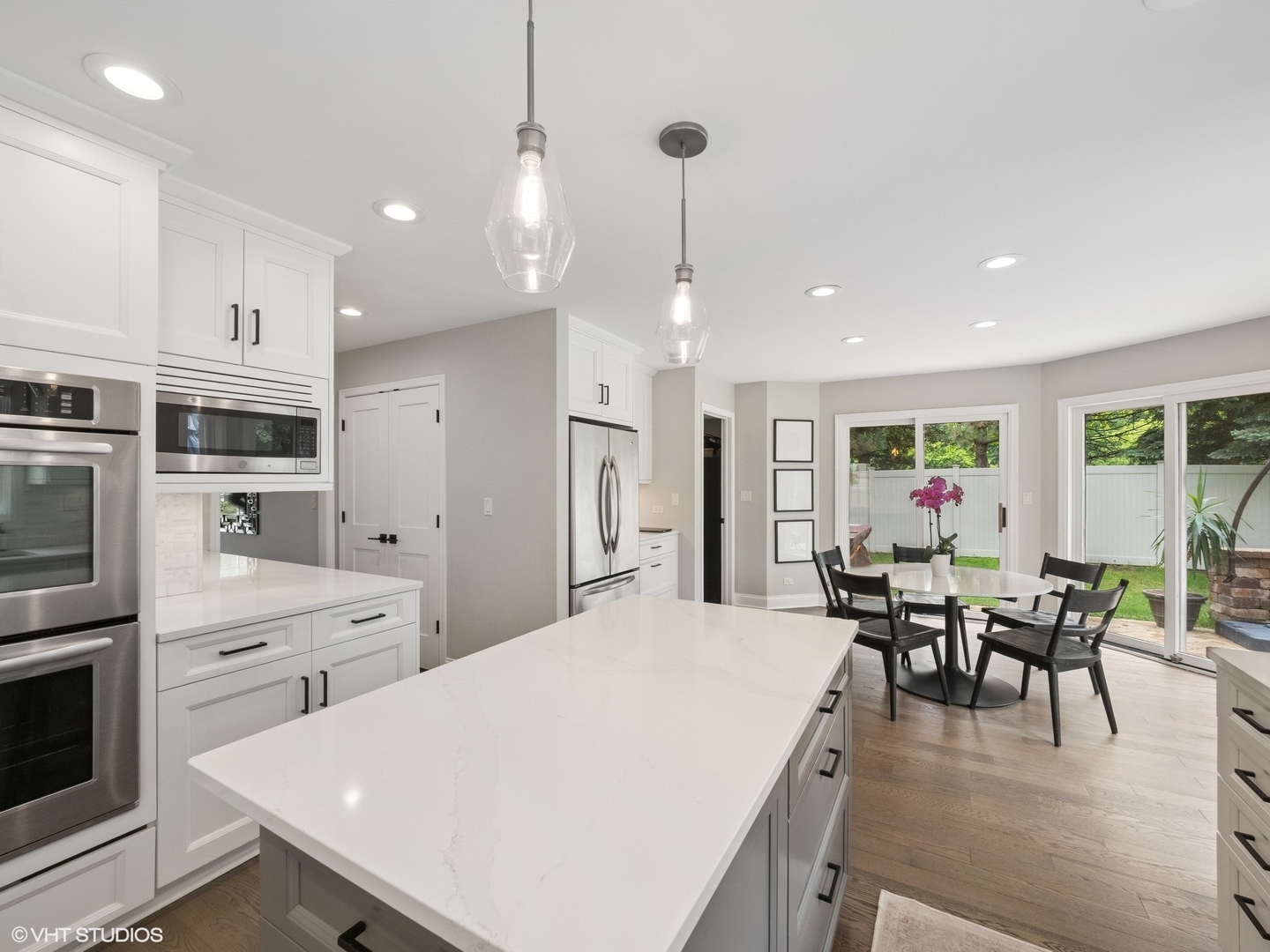 1002 Elmdale Road Glenview, IL 60025 - Photo 9 of 51 a large kitchen with a table and chairs